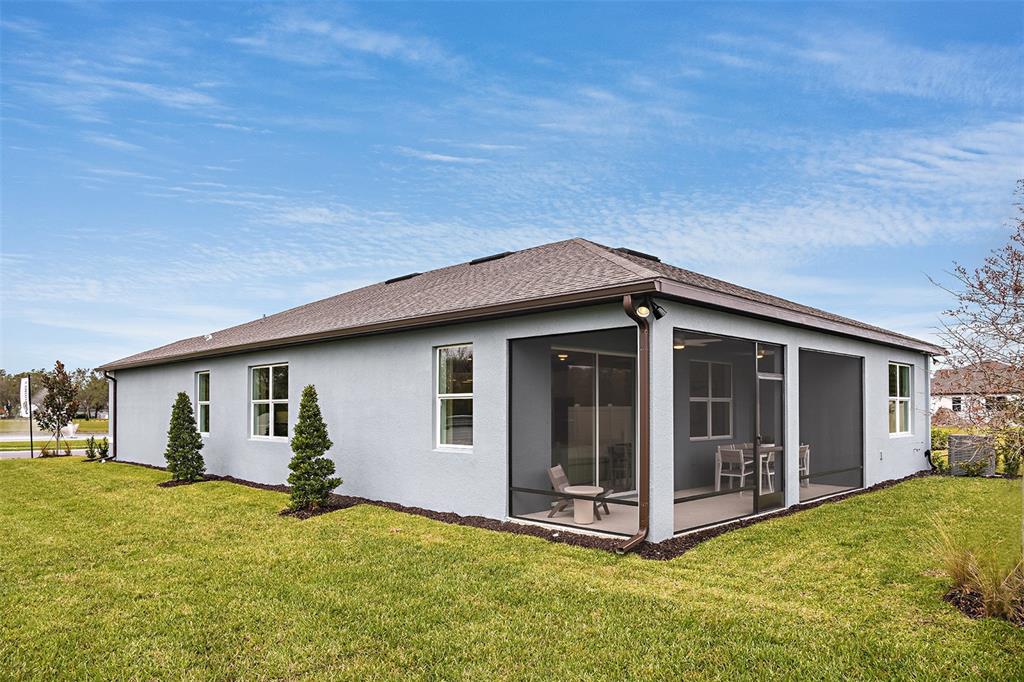 33425 Herds Hallow Way Wesley Chapel, FL 33545 - Photo 17 of 30 a view of a house with yard and garage
