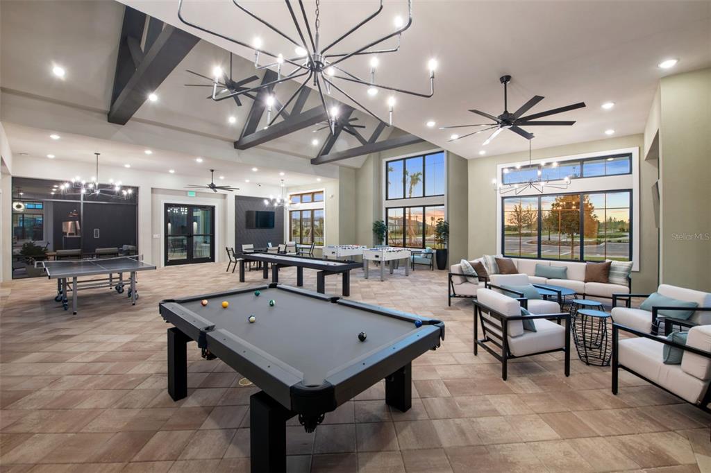 33425 Herds Hallow Way Wesley Chapel, FL 33545 - Photo 24 of 30 a living room with lots of furniture and a table