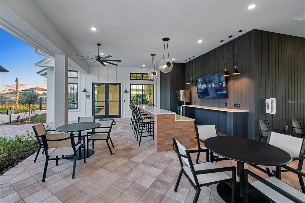 33425 Herds Hallow Way Wesley Chapel, FL 33545 - Photo 25 of 30 a dining room with furniture and wooden floor
