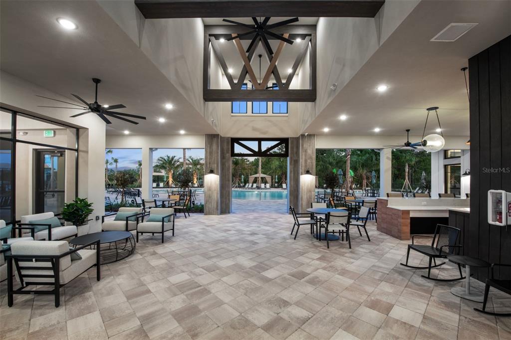 33425 Herds Hallow Way Wesley Chapel, FL 33545 - Photo 26 of 30 a view of a lobby with furniture and floor to ceiling window