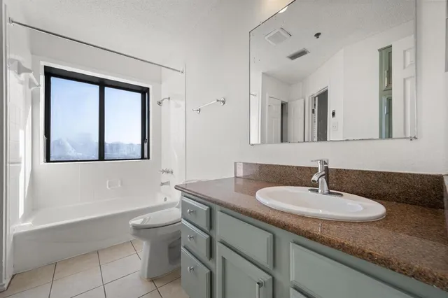 a view of a room with water heater and racks on the wall
