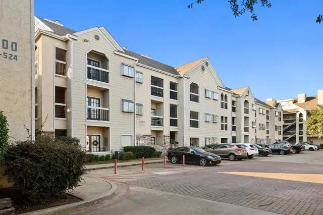 a view of a building with a street