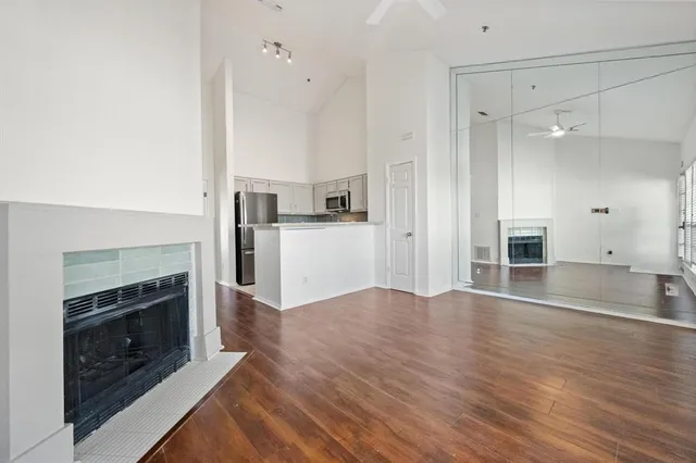 a view of a kitchen with a sink and a fireplace