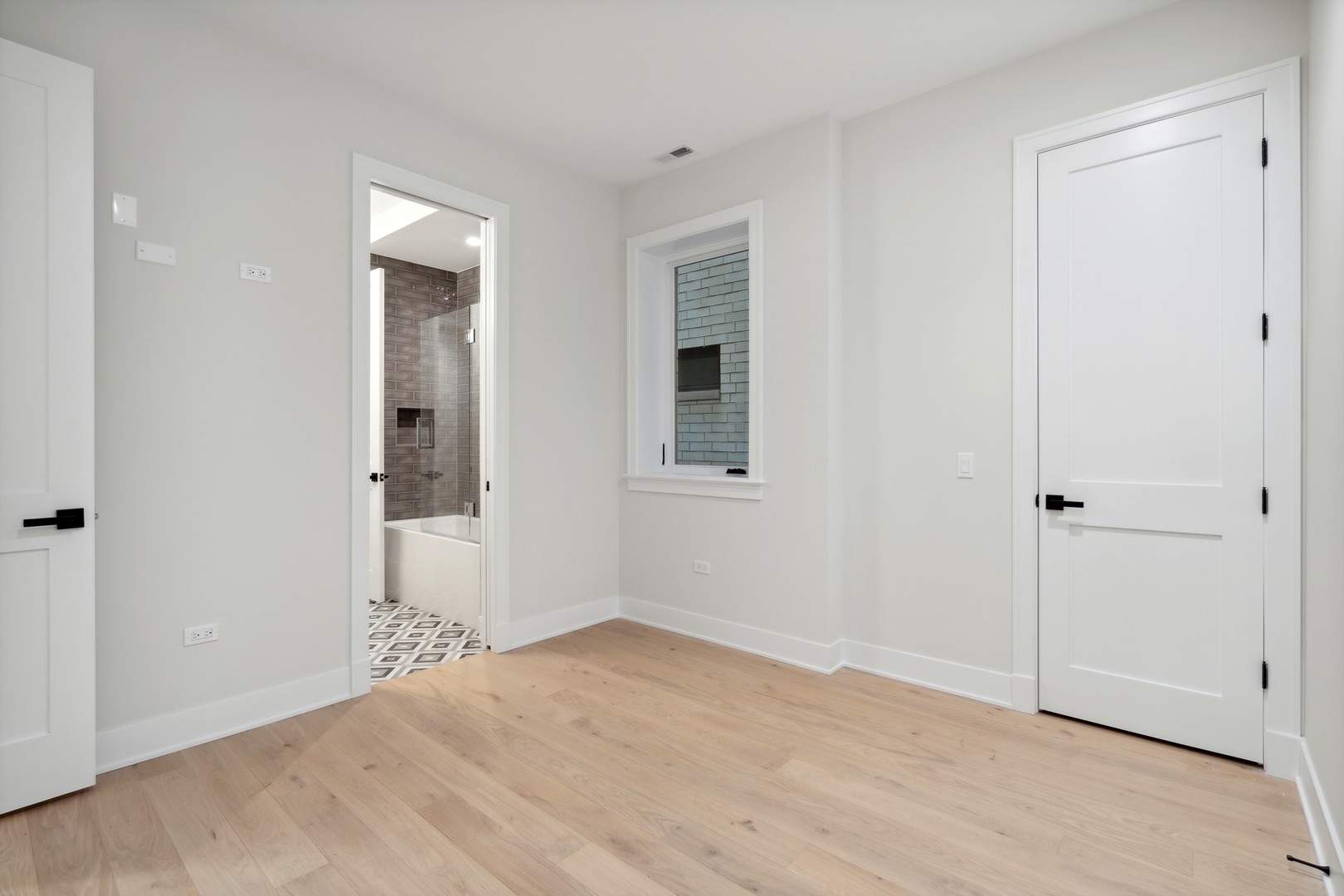232 South Green Street, Unit 3S Chicago, IL 60607 - Photo 16 of 23 a view of an empty room with wooden floor and closet