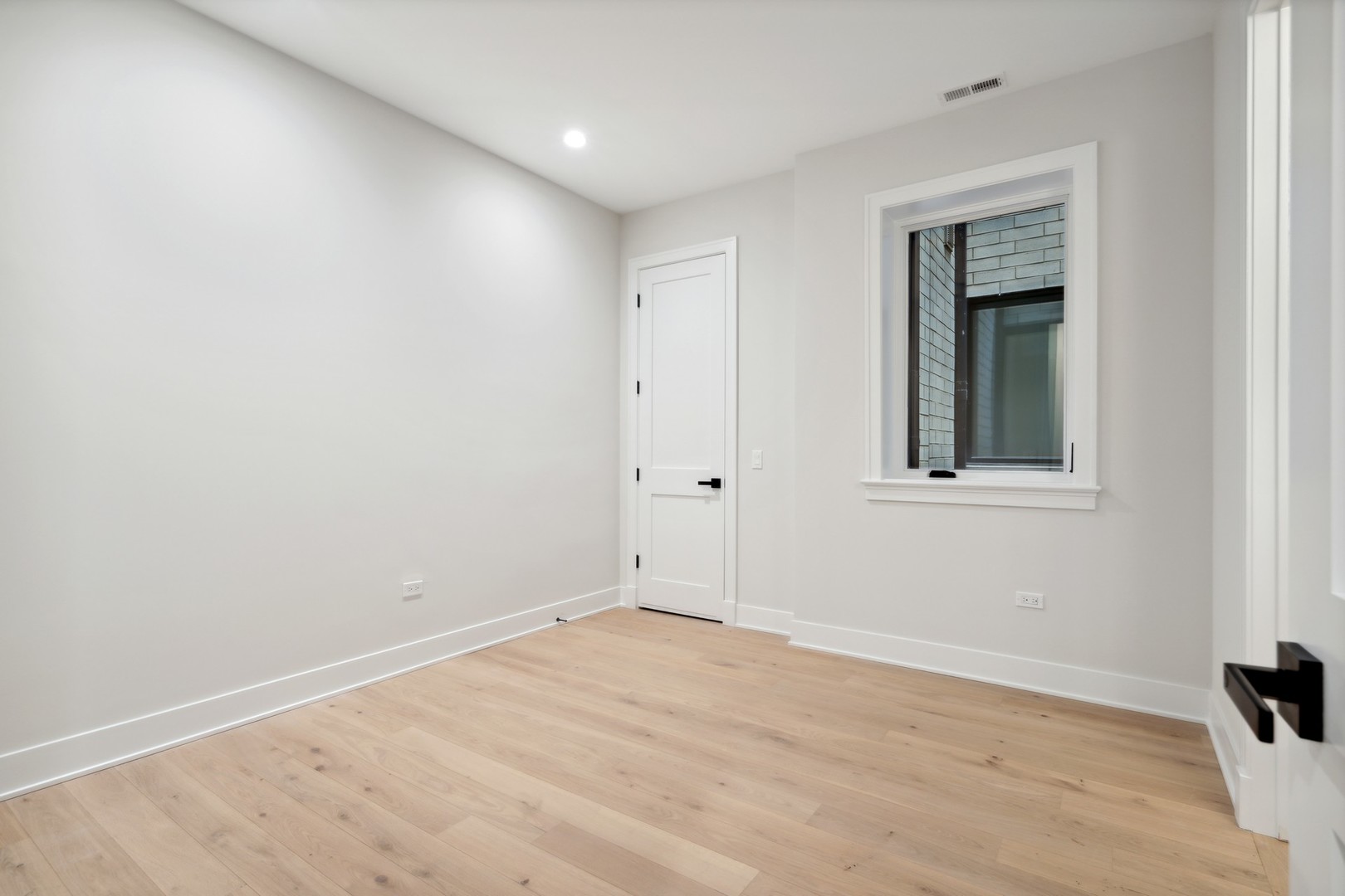 232 South Green Street, Unit 3S Chicago, IL 60607 - Photo 17 of 23 a view of empty room with wooden floor