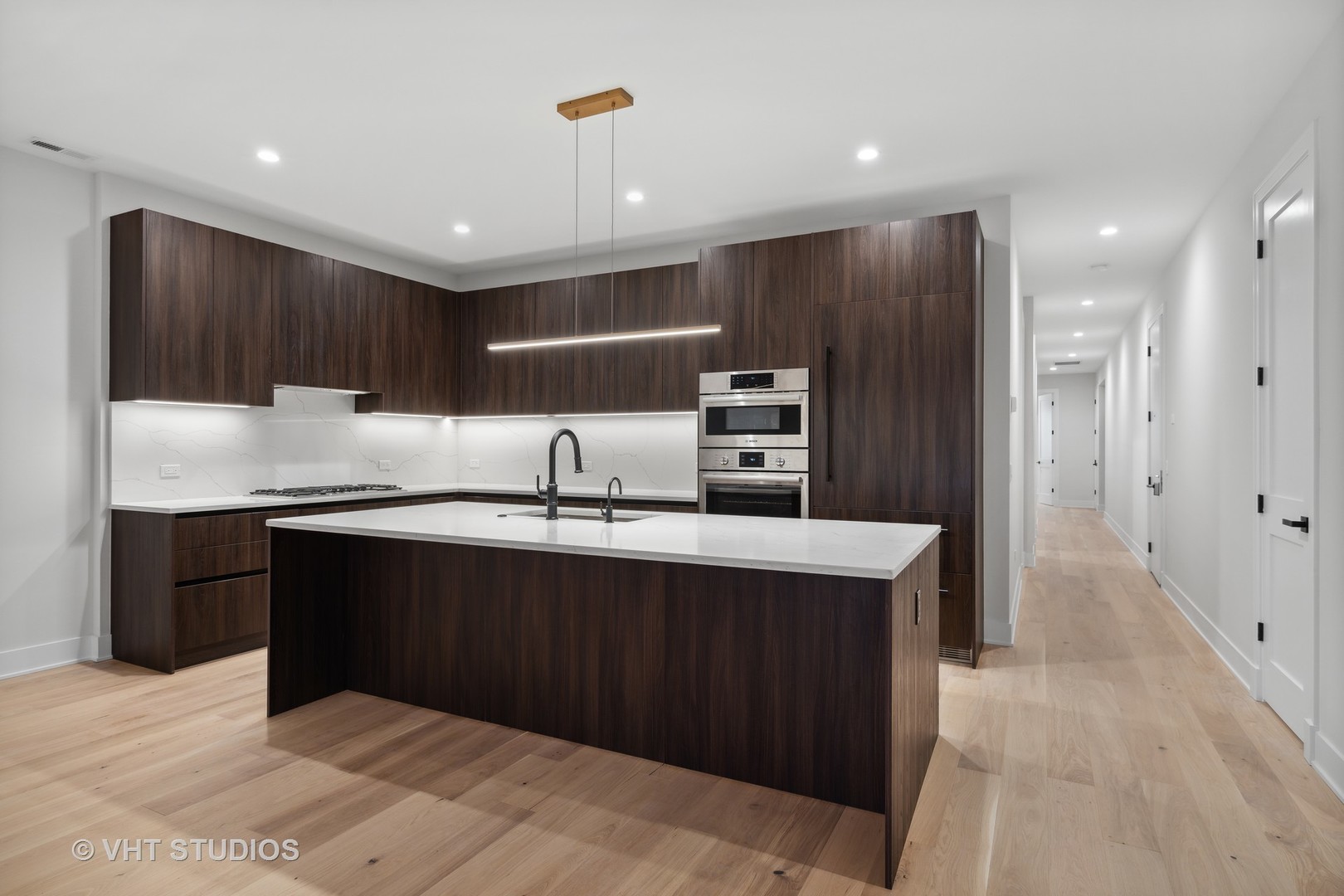 232 South Green Street, Unit 3S Chicago, IL 60607 - Photo 3 of 23 a kitchen with stainless steel appliances granite countertop a refrigerator and a sink