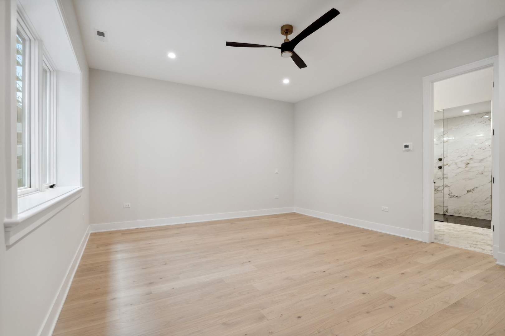 232 South Green Street, Unit 3S Chicago, IL 60607 - Photo 10 of 23 an empty room with closet and windows