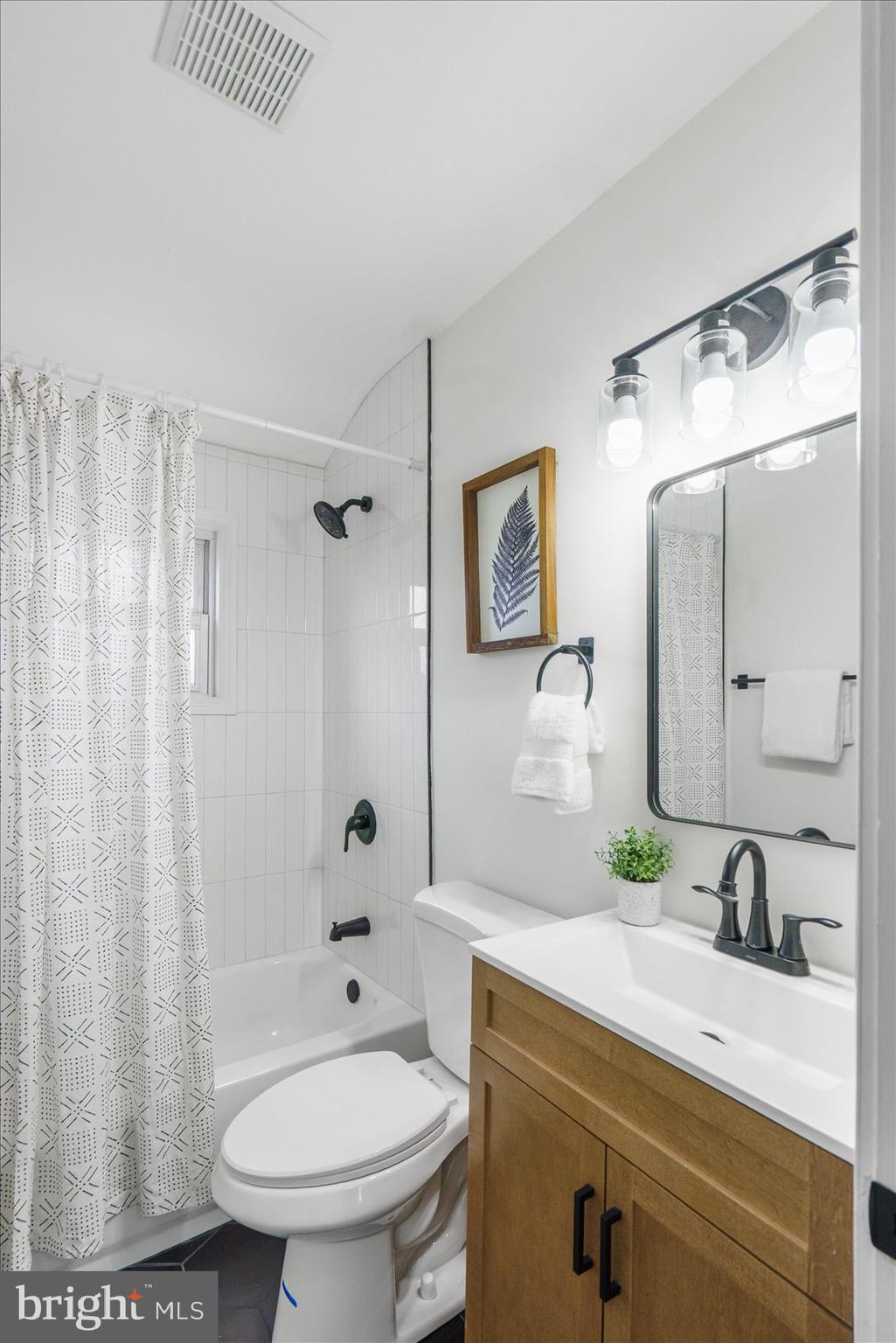 2053 Jasmine Road Baltimore, MD 21222 - Photo 25 of 34 a bathroom with a sink and a mirror