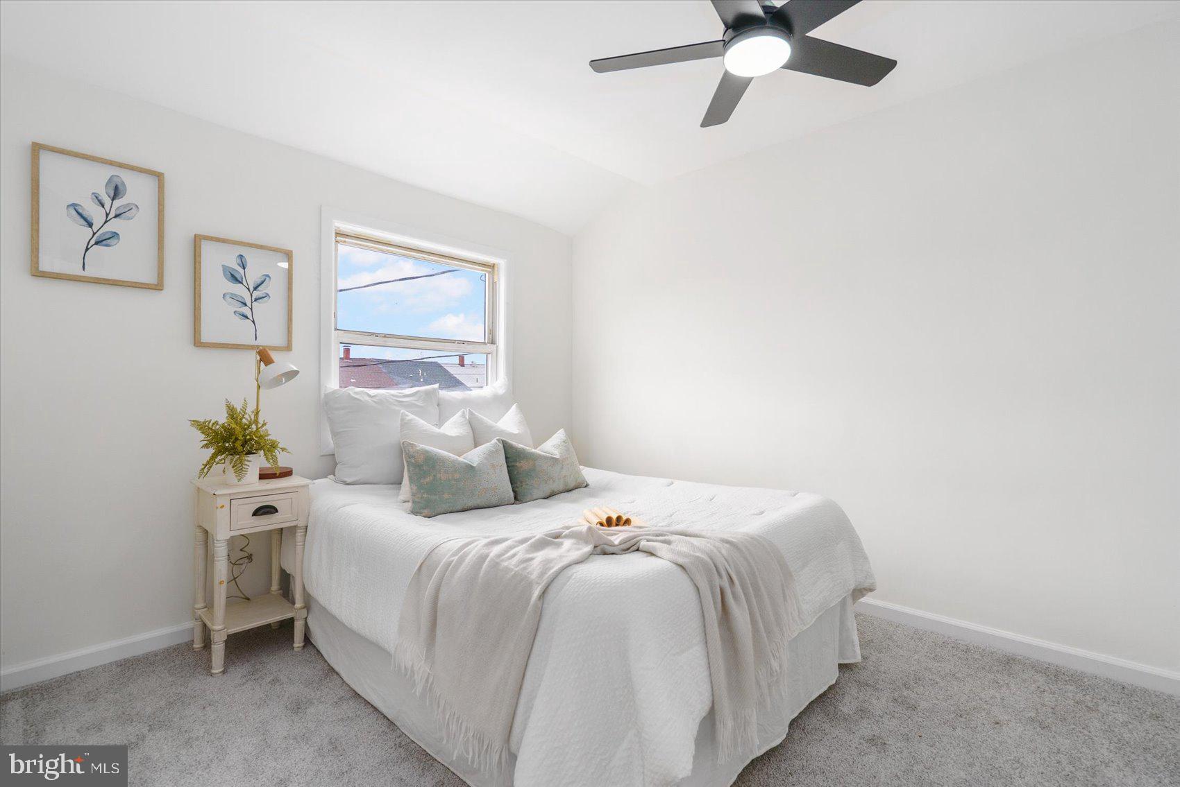 2053 Jasmine Road Baltimore, MD 21222 - Photo 27 of 34 a bedroom with a bed and window