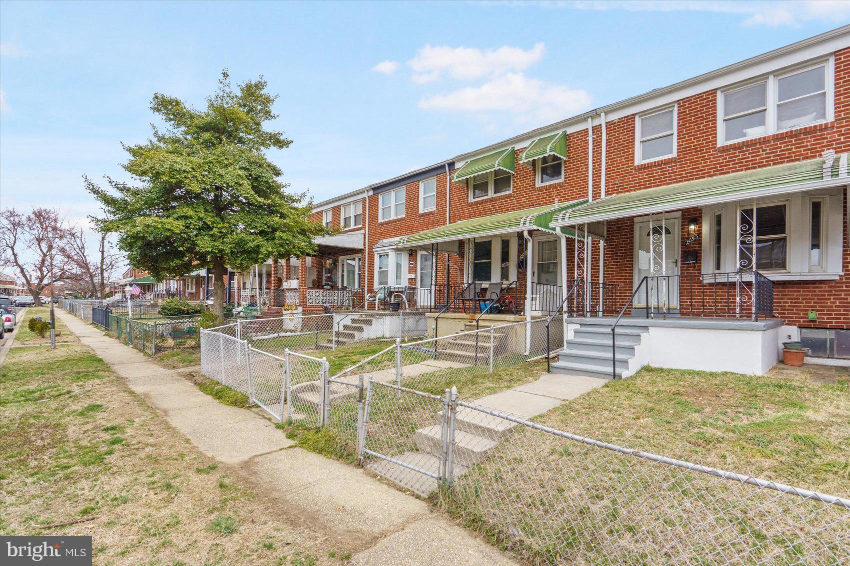 2053 Jasmine Road Baltimore, MD 21222 - Photo 3 of 34 a view of a building with a swimming pool