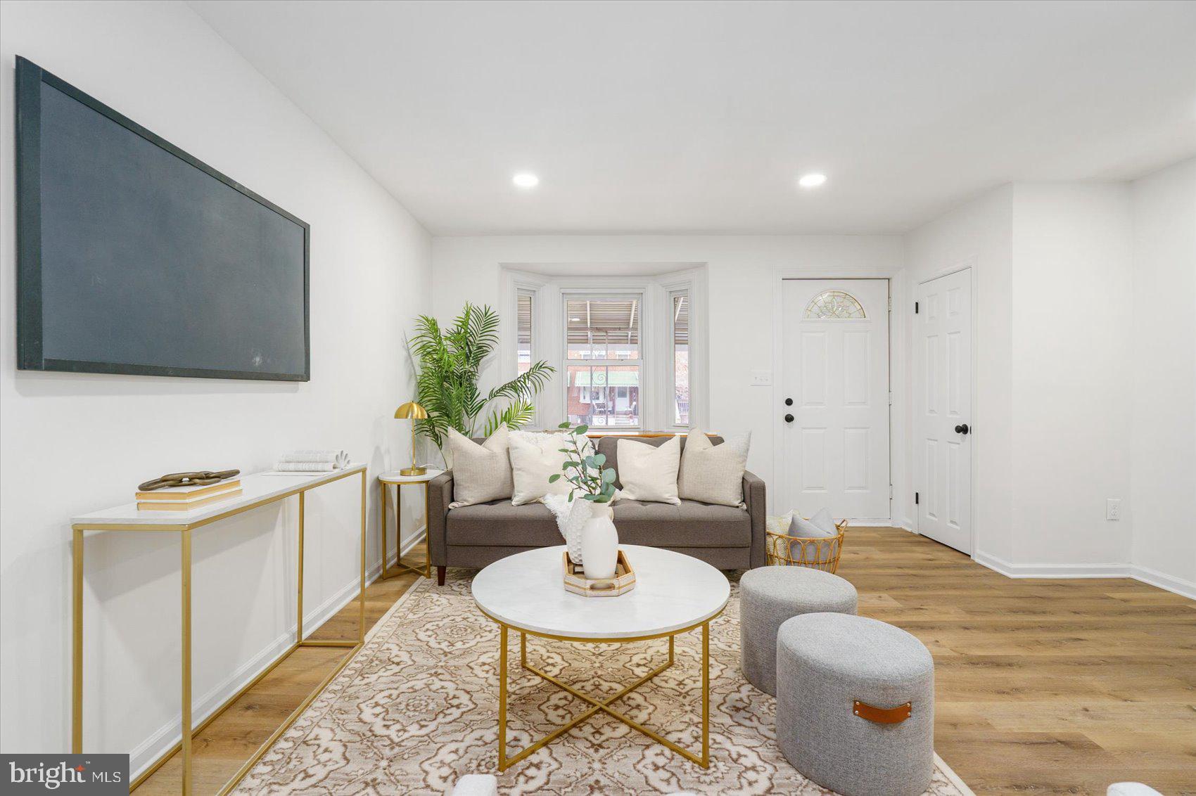 2053 Jasmine Road Baltimore, MD 21222 - Photo 10 of 34 a living room with furniture and a wooden floor