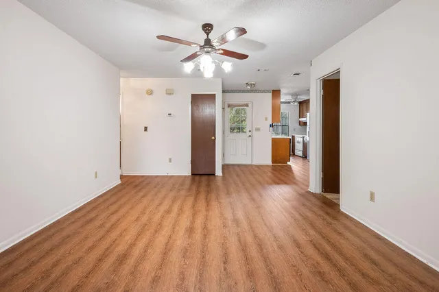 a view of a livingroom with furniture and chandelier