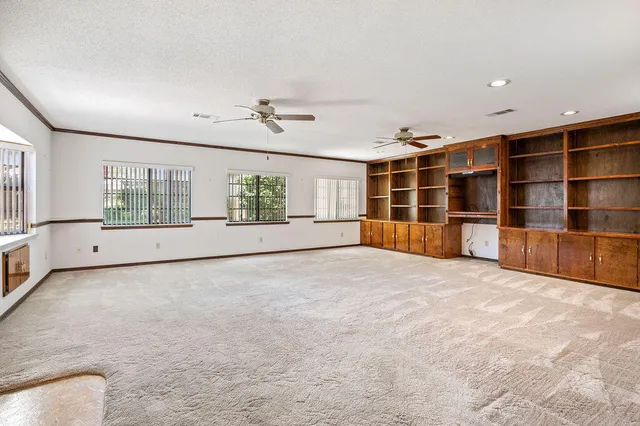 a view of empty room with windows
