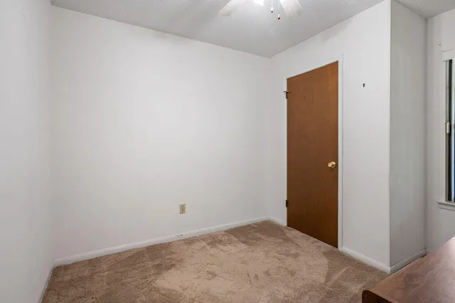 a view of a room with a large window