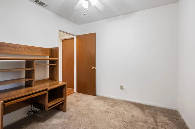 a view of backyard with outdoor seating and trees