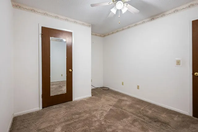 a patio with yard glass top table and chairs