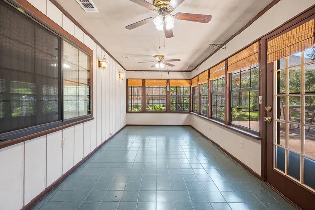 a view of a house with backyard porch and garden