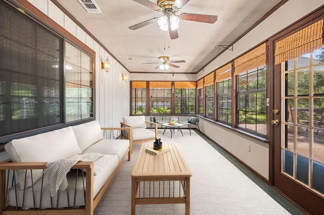 a view of a backyard with large tree