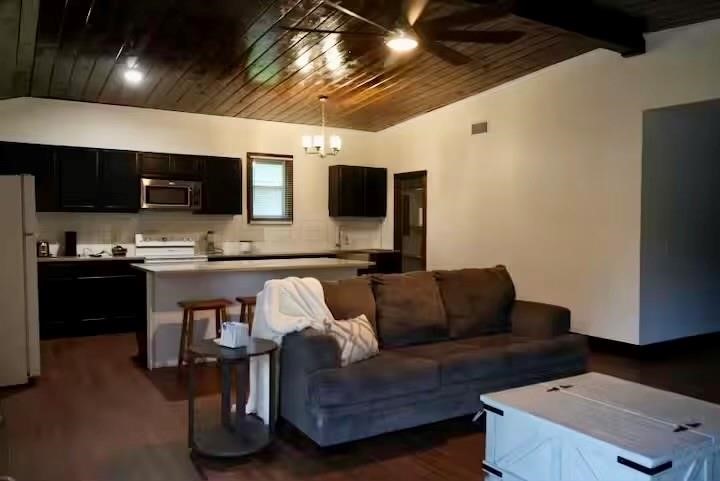 991 Kovar Road, Unit D Flatonia, TX 78941 - Photo 7 of 12 a living room with furniture and a flat screen tv