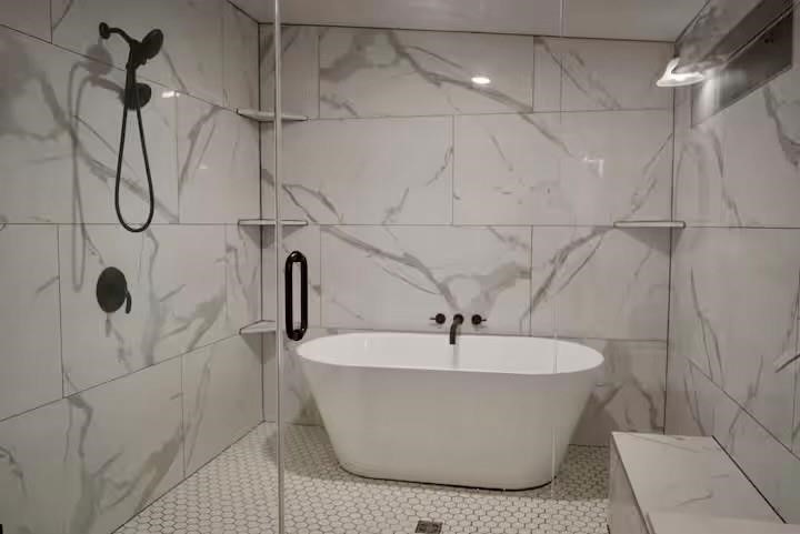 991 Kovar Road, Unit D Flatonia, TX 78941 - Photo 10 of 12 a white tub sitting next to a shower