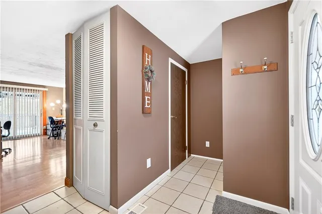 a view of a livingroom with a walk in closet and bedroom