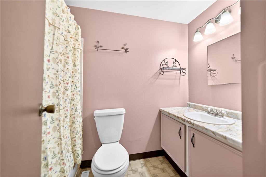 37 Hones Road Export, PA 15632 - Photo 26 of 37 a white toilet sitting next to a bathroom sink