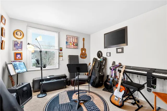 a view of a livingroom with furniture and a flat screen tv