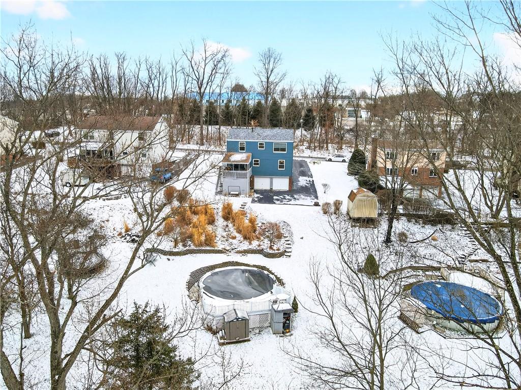 37 Hones Road Export, PA 15632 - Photo 3 of 37 a view of a swimming pool with outdoor seating and trees in the background