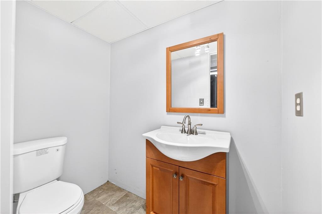 37 Hones Road Export, PA 15632 - Photo 32 of 37 a bathroom with a sink vanity mirror and toilet