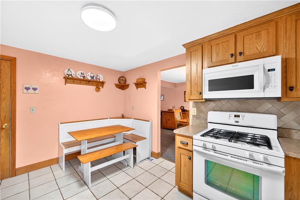 37 Hones Road Export, PA 15632 - Photo 7 of 37 a kitchen with stainless steel appliances a stove a microwave and cabinets