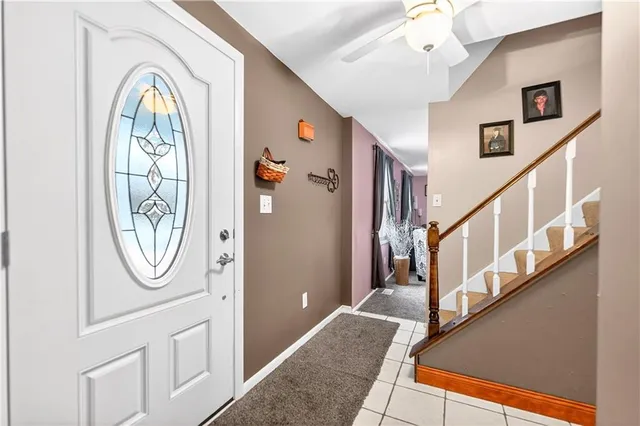 a view of an entryway with wooden floor and mirror
