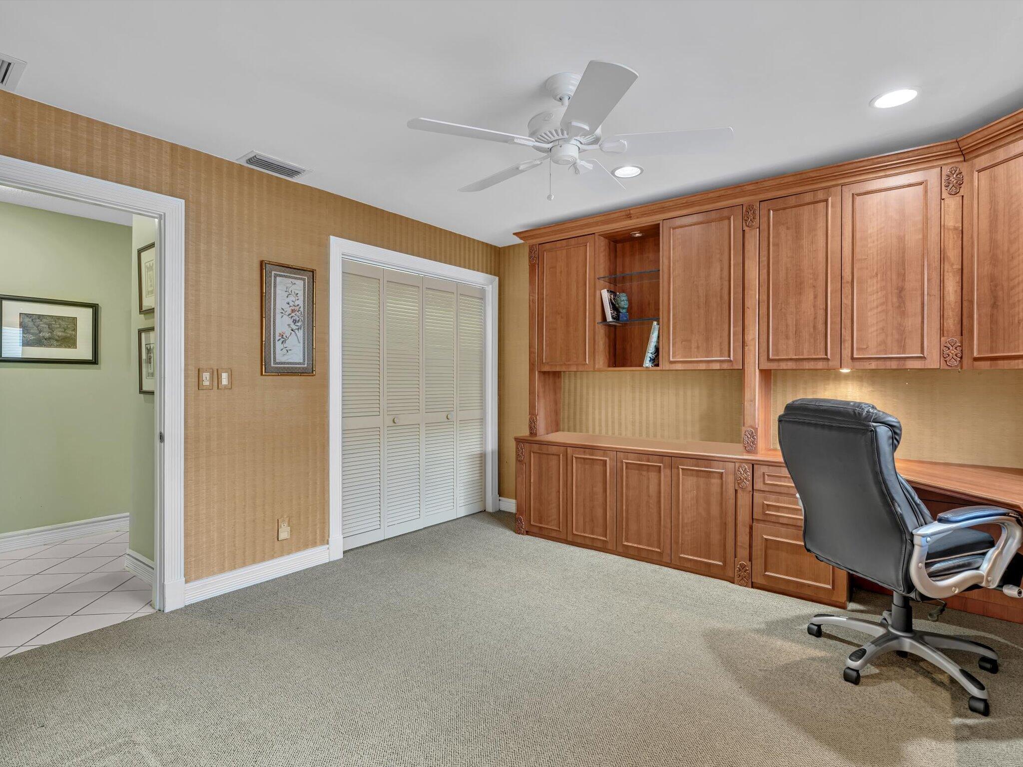 10122 Spyglass Way Boca Raton, FL 33498 - Photo 15 of 65 a view of a workspace with furniture and a chandelier