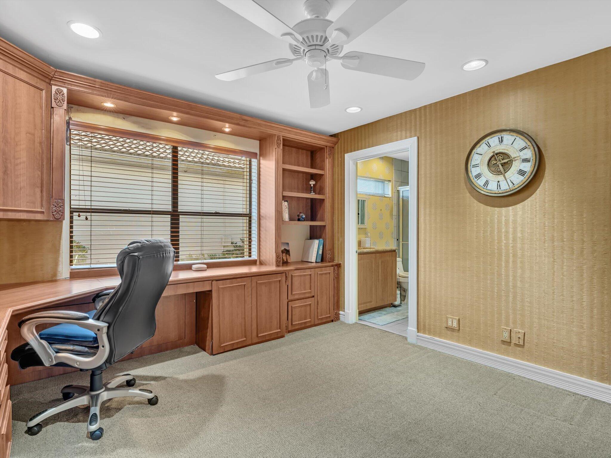 10122 Spyglass Way Boca Raton, FL 33498 - Photo 17 of 65 a view of a workspace with furniture and a window