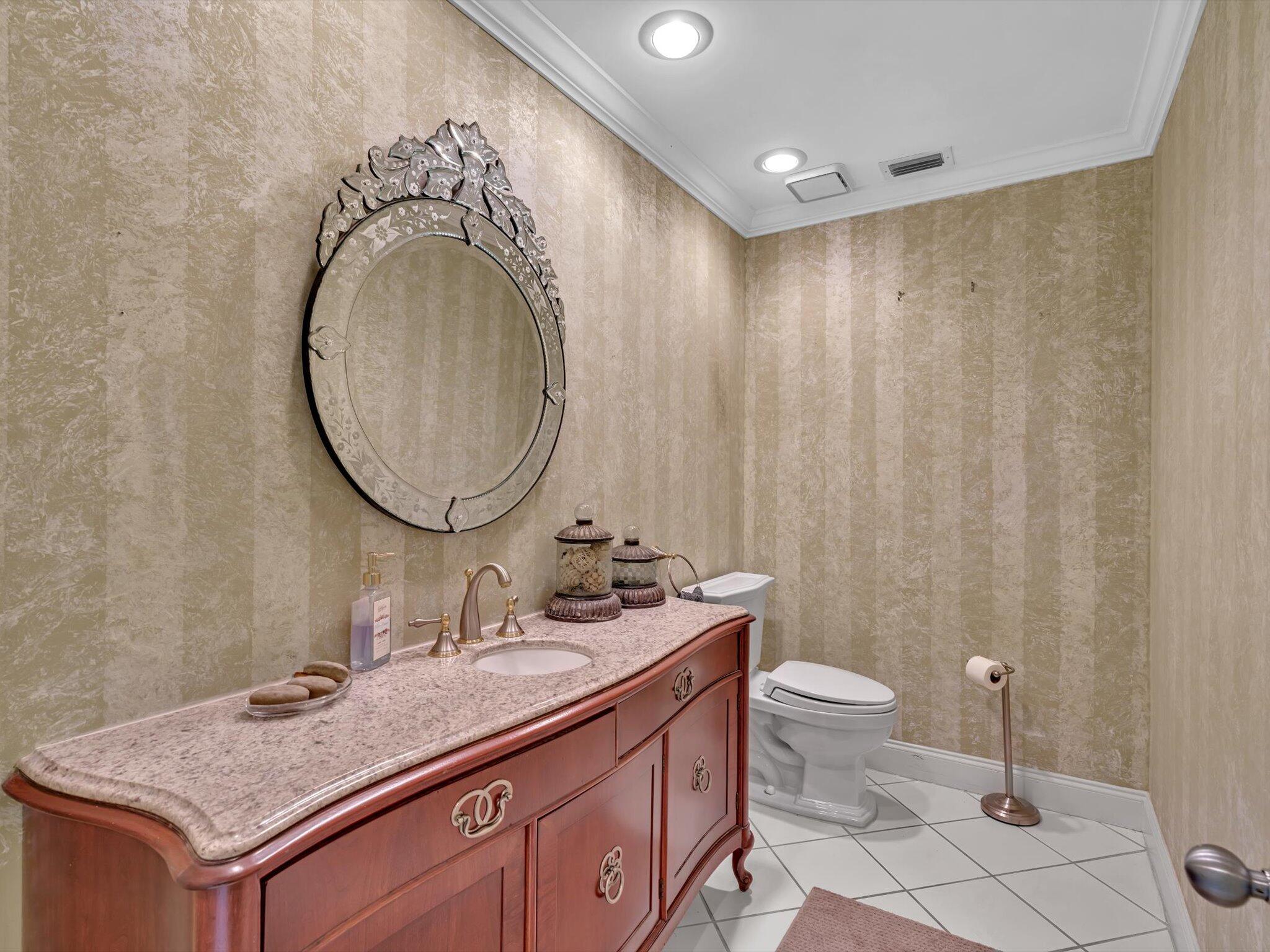 10122 Spyglass Way Boca Raton, FL 33498 - Photo 25 of 65 a bathroom with a granite countertop sink and a mirror