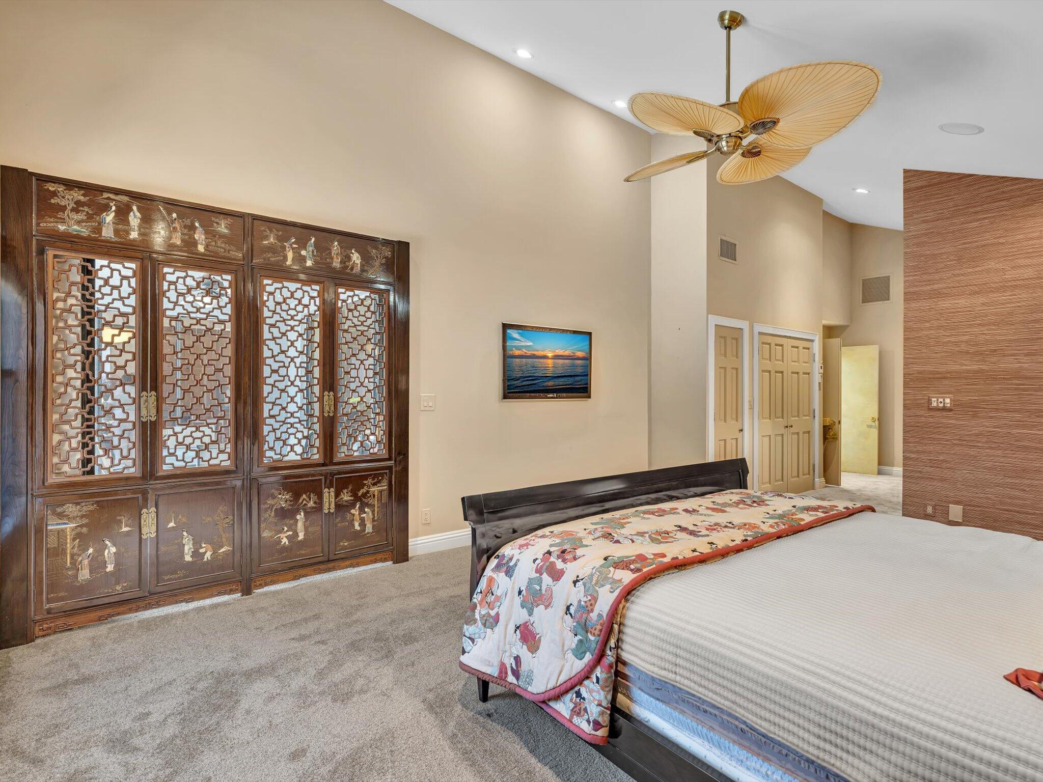 10122 Spyglass Way Boca Raton, FL 33498 - Photo 27 of 65 a bedroom with a large bed and a large window