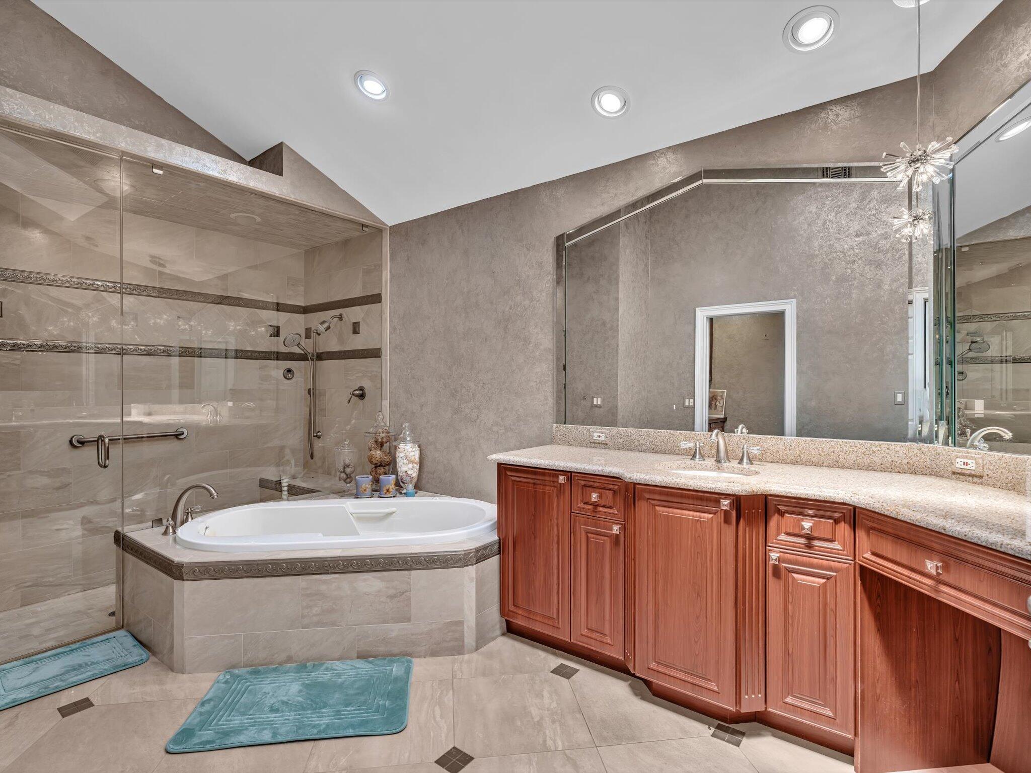 10122 Spyglass Way Boca Raton, FL 33498 - Photo 33 of 65 a bathroom with a double vanity sink mirror and bathtub