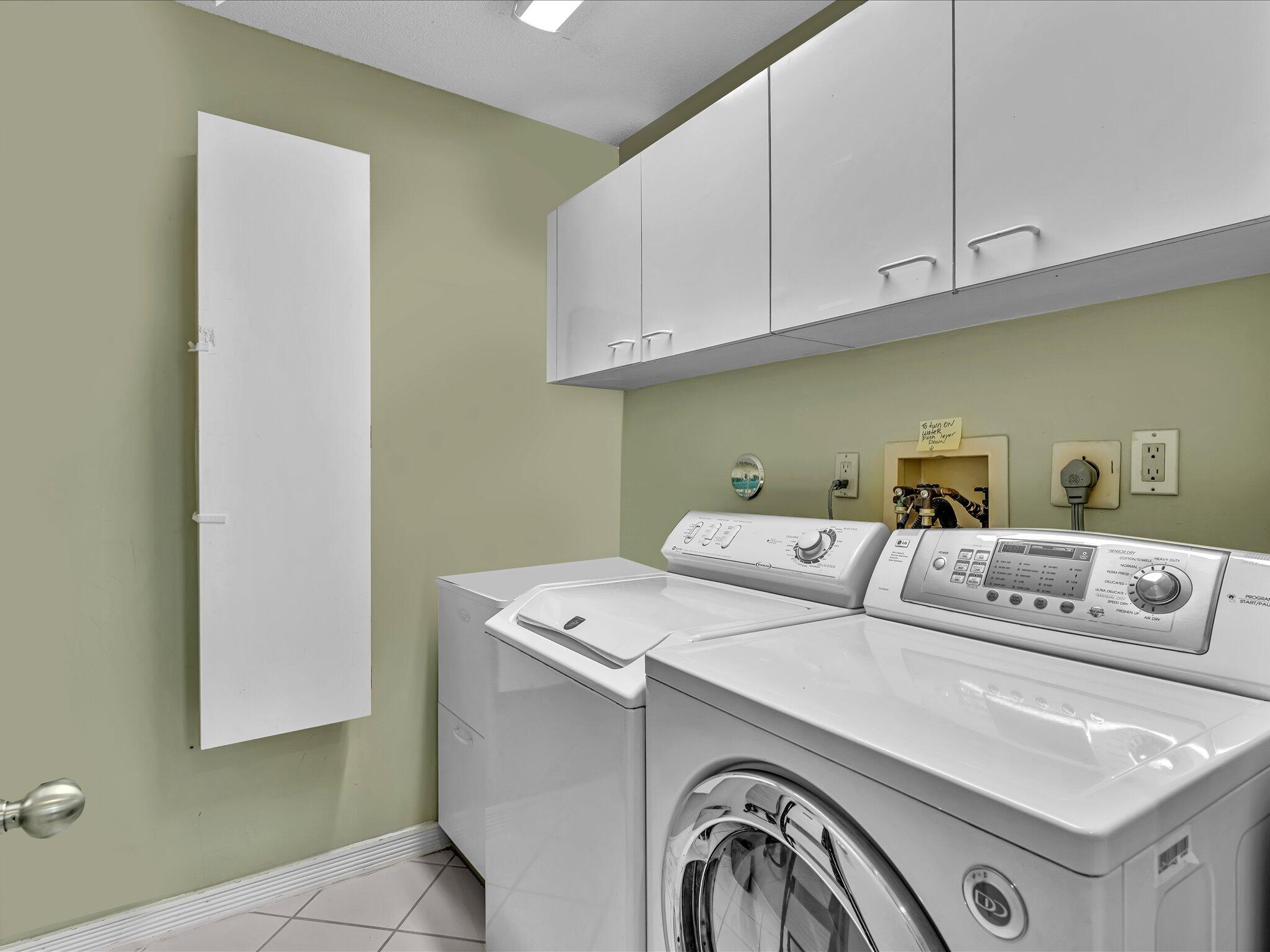 10122 Spyglass Way Boca Raton, FL 33498 - Photo 40 of 65 a utility room with dryer and washer