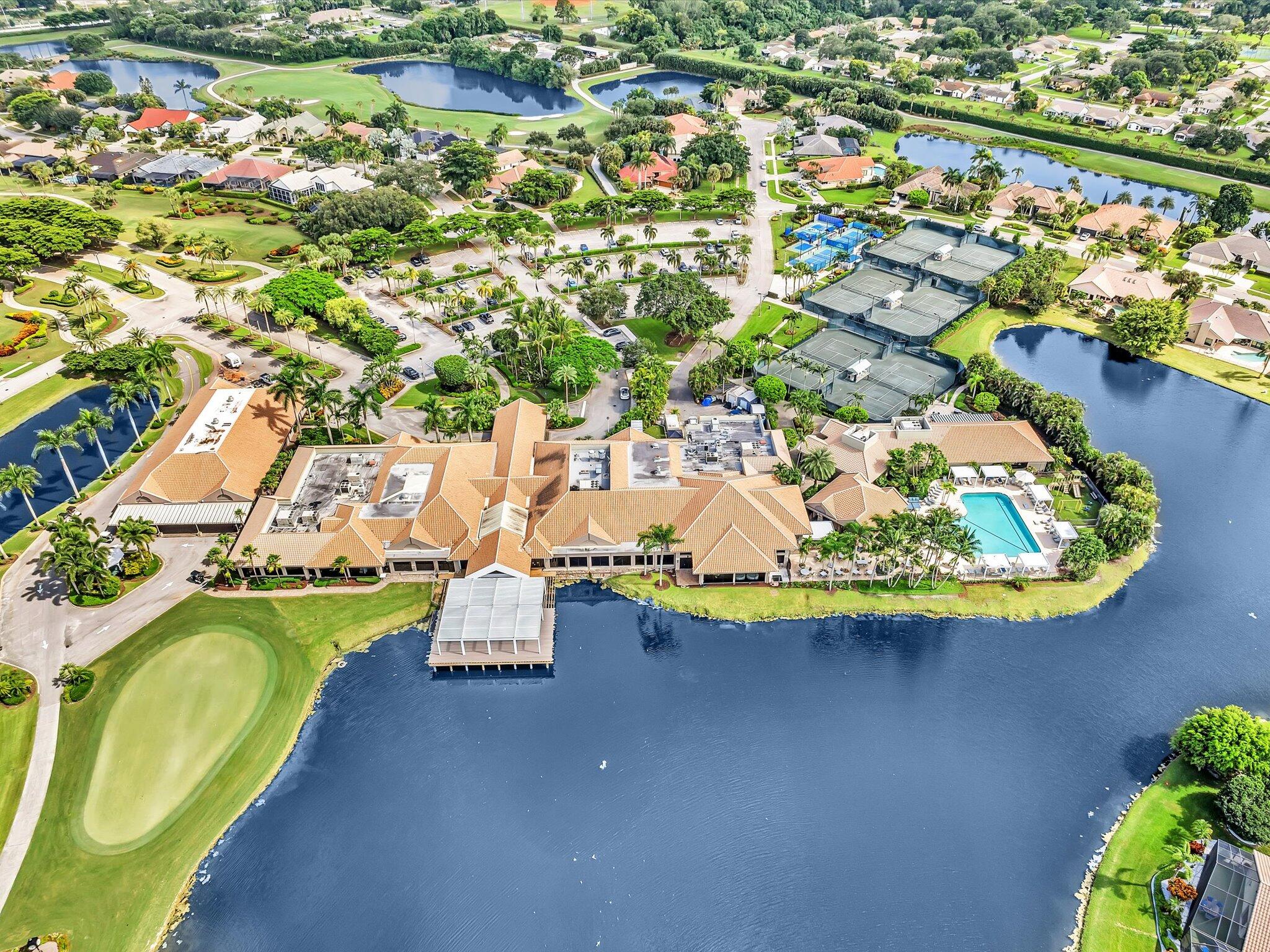 10122 Spyglass Way Boca Raton, FL 33498 - Photo 57 of 65 a view of a swimming pool with a yard