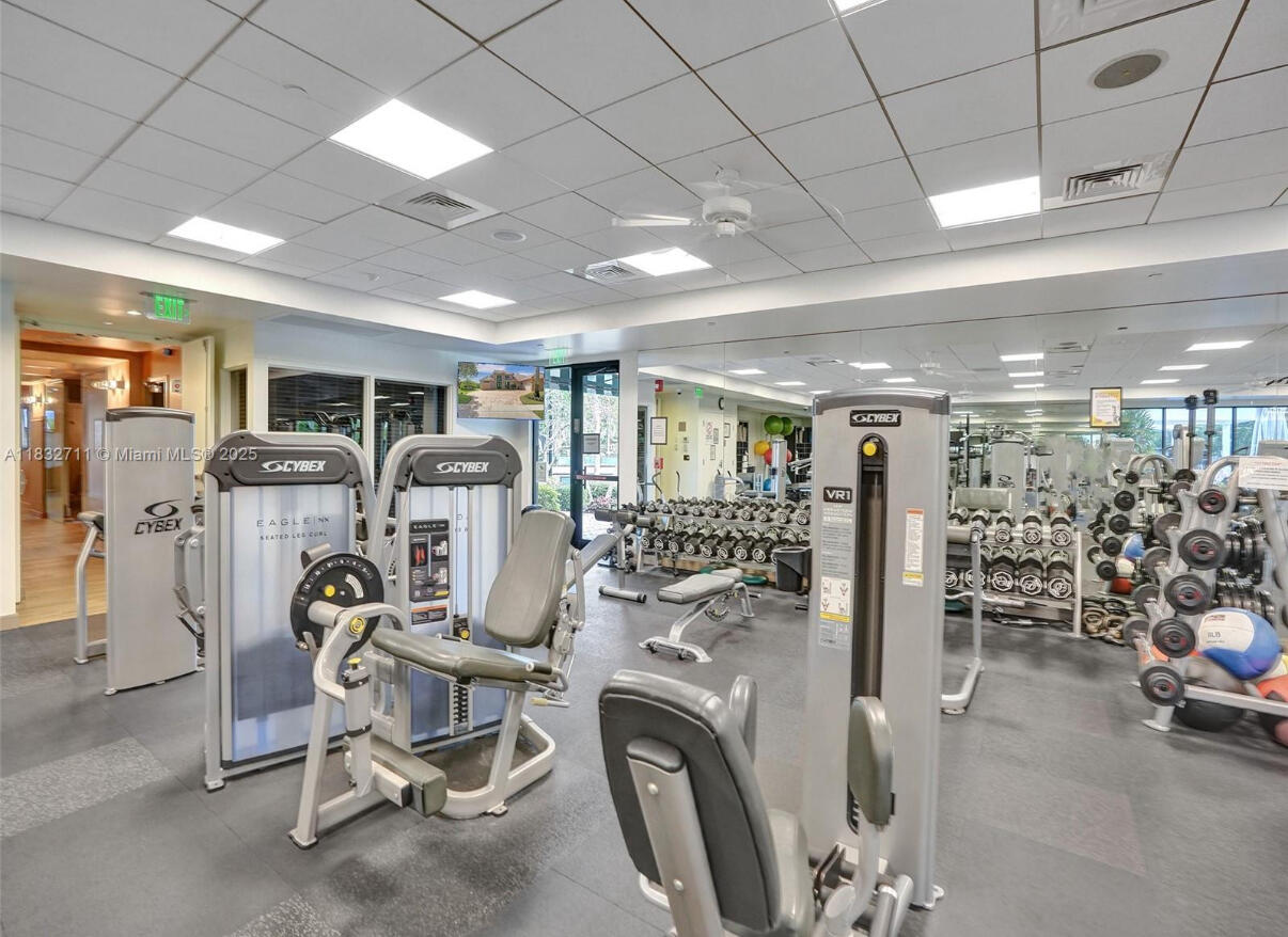 10122 Spyglass Way Boca Raton, FL 33498 - Photo 63 of 65 a view of a room with gym equipment