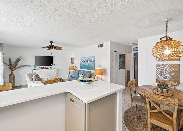 1030 East US Highway 98, Unit 203A Destin, FL 32541 - Photo 12 of 35 a dining room with furniture and view of kitchen