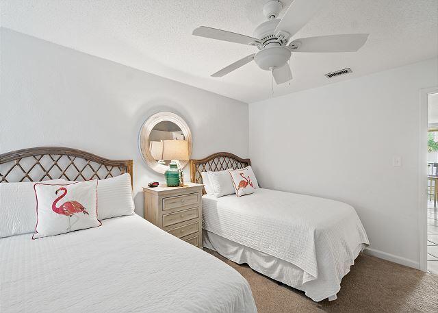 1030 East US Highway 98, Unit 203A Destin, FL 32541 - Photo 23 of 35 a bedroom with two beds and window