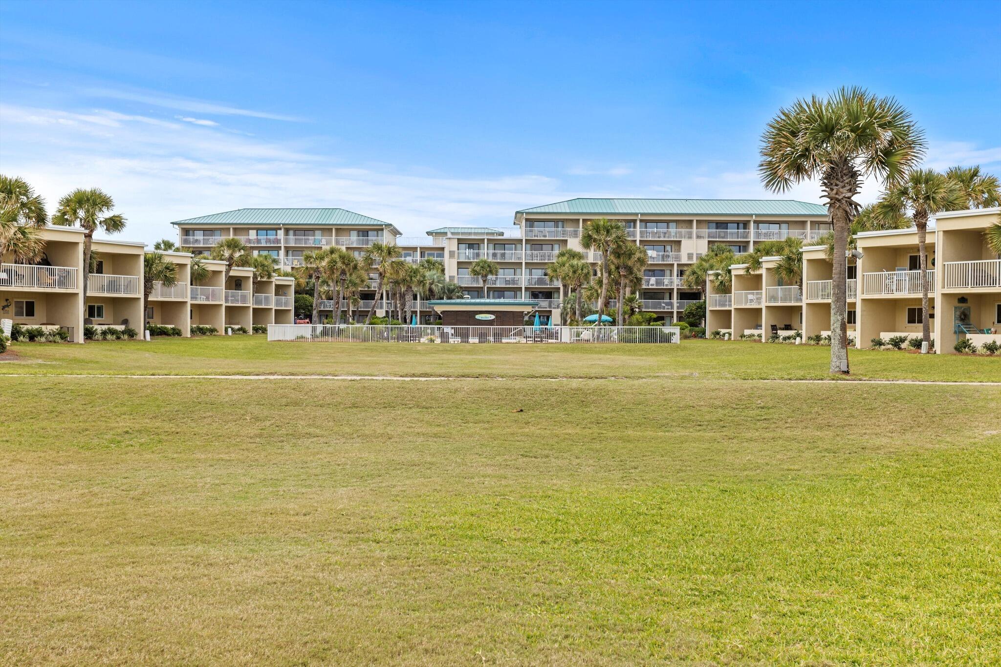 1030 East US Highway 98, Unit 203A Destin, FL 32541 - Photo 32 of 35 a view of an ocean with a building in the background