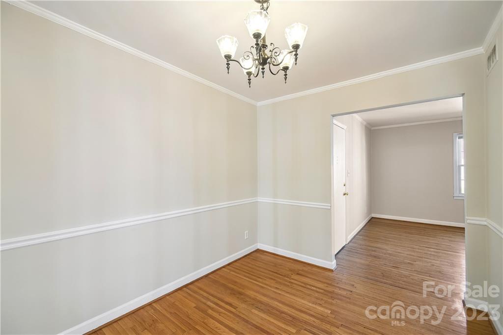 914 McAlway Road Charlotte, NC 28211 - Photo 14 of 44 a view of an empty room with wooden floor