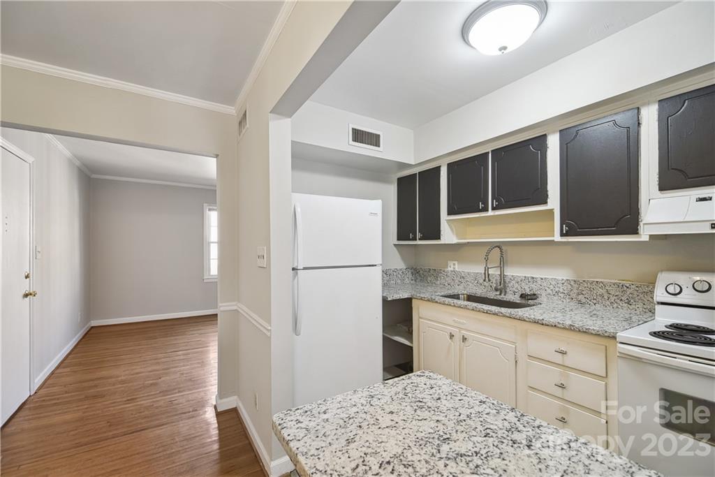 914 McAlway Road Charlotte, NC 28211 - Photo 15 of 44 a kitchen with a sink stove and refrigerator