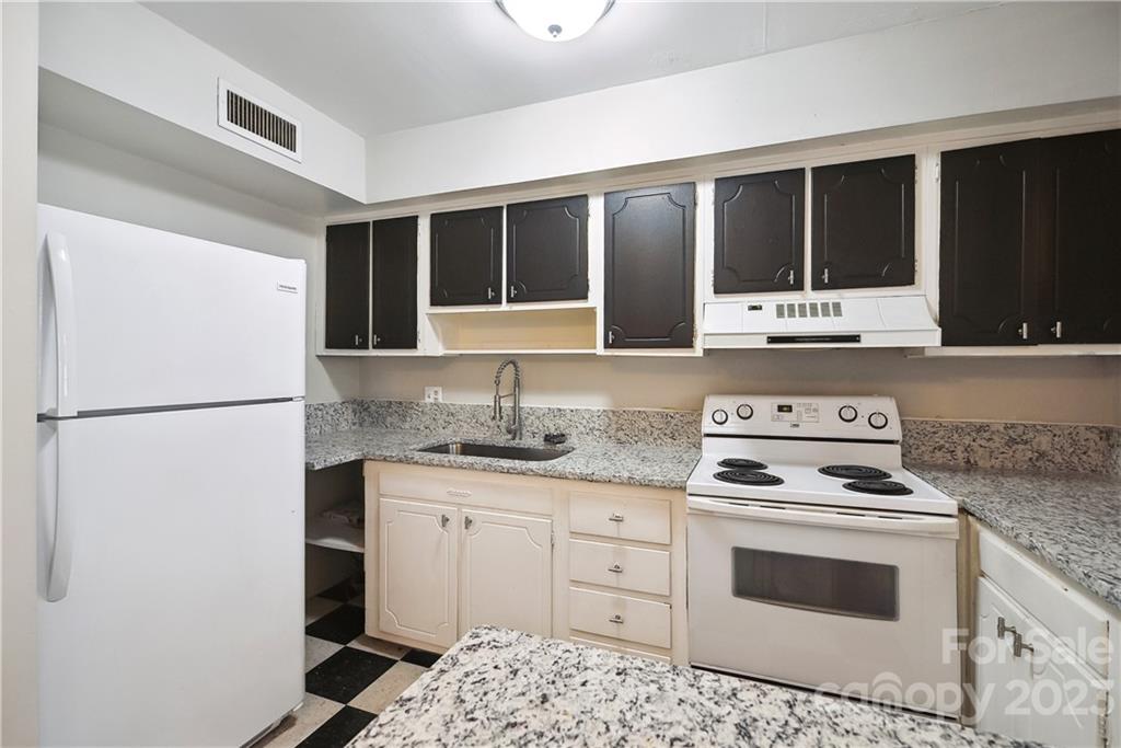 914 McAlway Road Charlotte, NC 28211 - Photo 16 of 44 a kitchen with granite countertop a sink cabinets and stainless steel appliances
