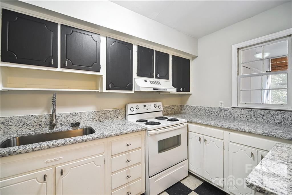 914 McAlway Road Charlotte, NC 28211 - Photo 17 of 44 a kitchen with granite countertop white cabinets and white appliances