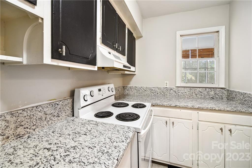 914 McAlway Road Charlotte, NC 28211 - Photo 18 of 44 a kitchen with a sink a stove and a microwave