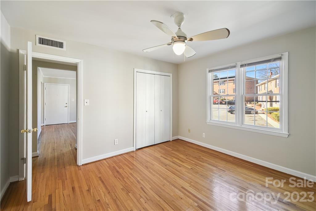 914 McAlway Road Charlotte, NC 28211 - Photo 24 of 44 a view of an empty room with wooden floor and a window