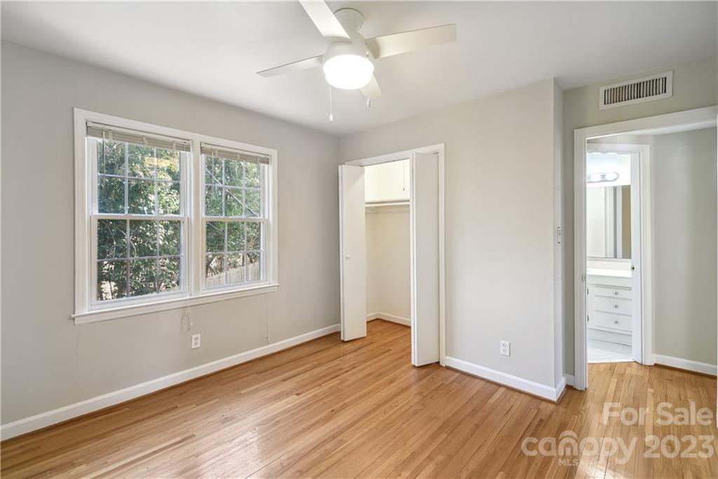 914 McAlway Road Charlotte, NC 28211 - Photo 27 of 44 a view of an empty room with wooden floor and a window