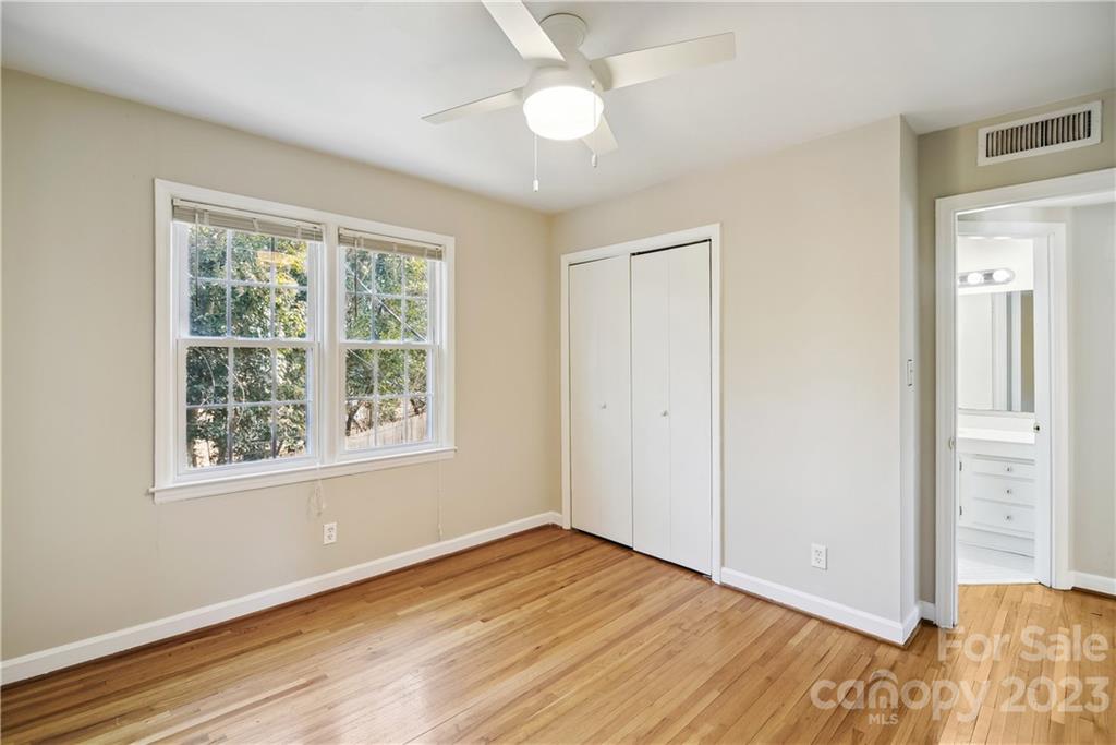 914 McAlway Road Charlotte, NC 28211 - Photo 30 of 44 a view of an empty room with wooden floor and a window